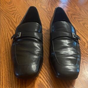 Prada Black Leather Slip-On Loafers with Buckle Accent